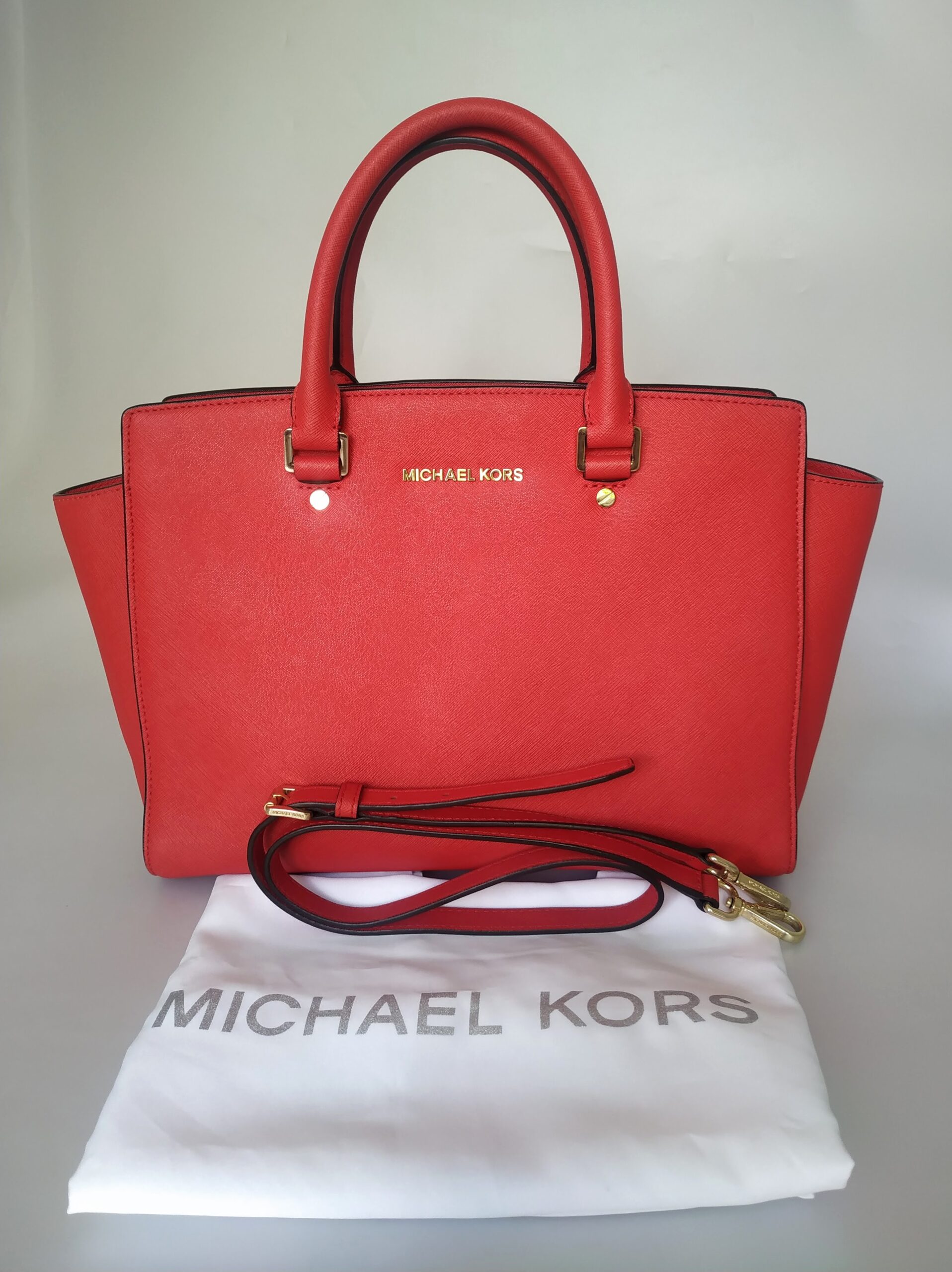 Buy the Michael Kors Saffiano Leather Small Selma Crossbody Bag Orange Red